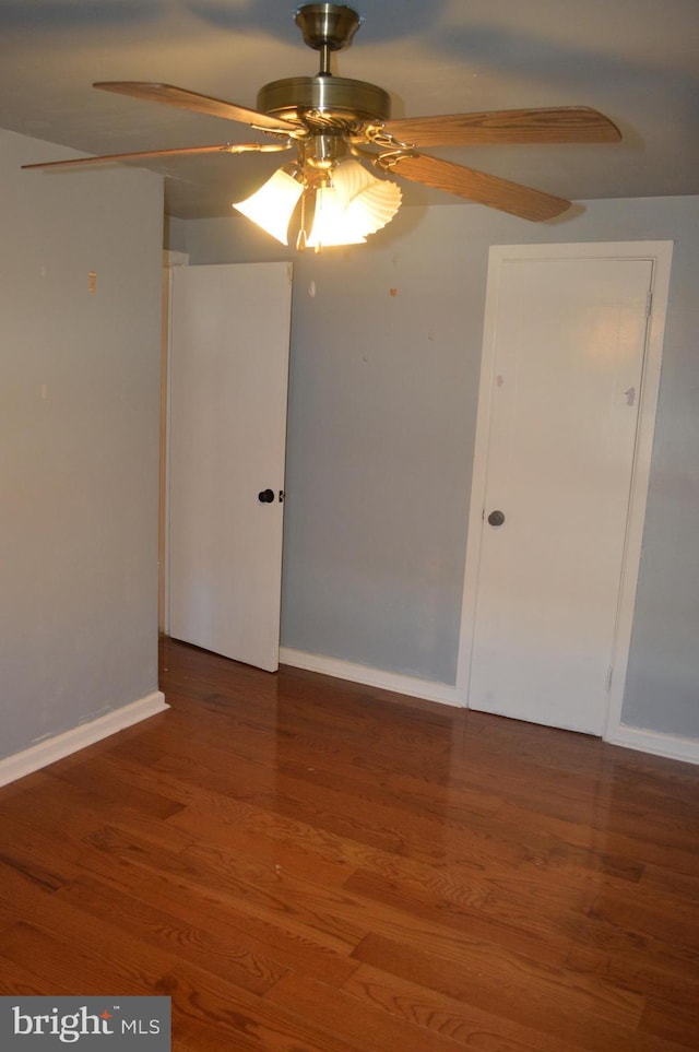 spare room with ceiling fan and hardwood / wood-style floors