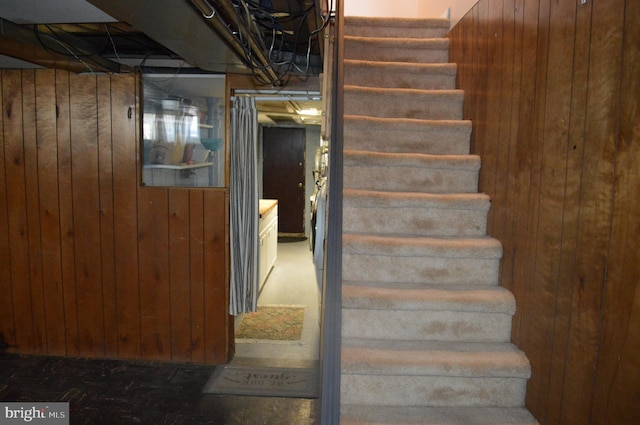 staircase with wooden walls