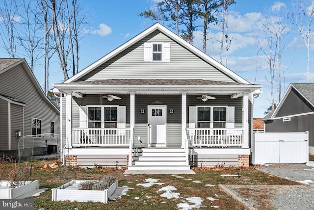 bungalow-style home featuring ceiling fan, covered porch, and cooling unit