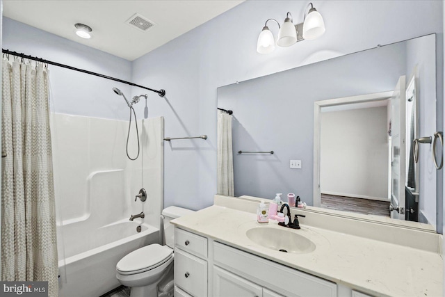 full bathroom featuring toilet, shower / bath combo with shower curtain, and vanity