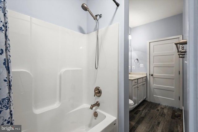 full bathroom featuring shower / tub combo, toilet, vanity, and hardwood / wood-style flooring