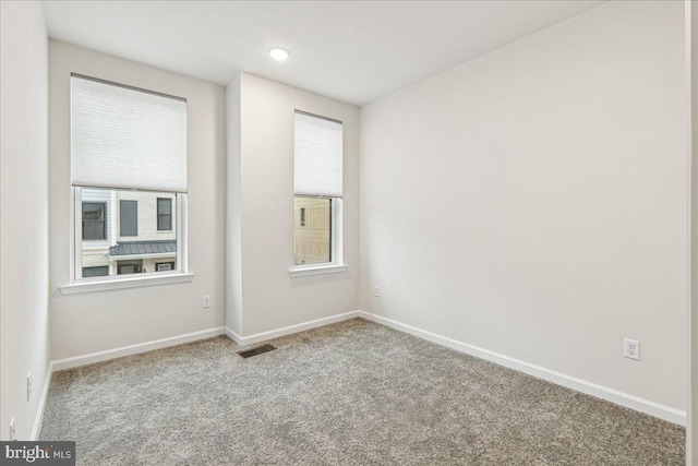 empty room with light colored carpet