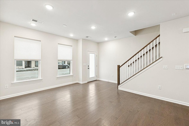 entrance foyer featuring dark hardwood / wood-style floors