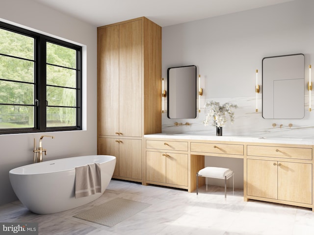 bathroom featuring vanity and a bathtub