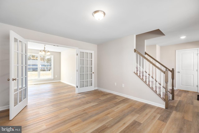 LOT4 Lakeview Dr, Colonial Beach, VA 22443 - spare room with a chandelier, stairway, light wood-type flooring, and baseboards