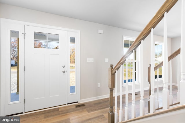 LOT4 Lakeview Dr, Colonial Beach, VA 22443 - entrance foyer featuring visible vents, stairway, baseboards, and wood finished floors