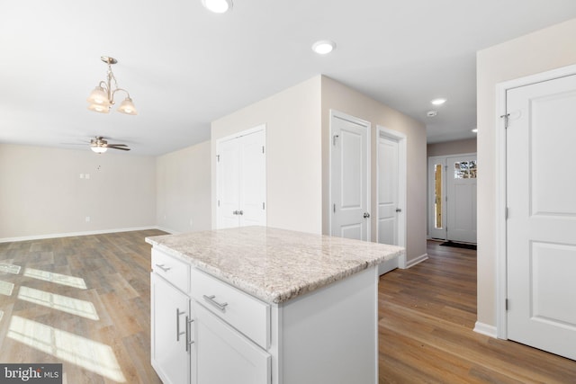 LOT4 Lakeview Dr, Colonial Beach, VA 22443 - kitchen with ceiling fan with notable chandelier, baseboards, white cabinetry, and light wood-style floors