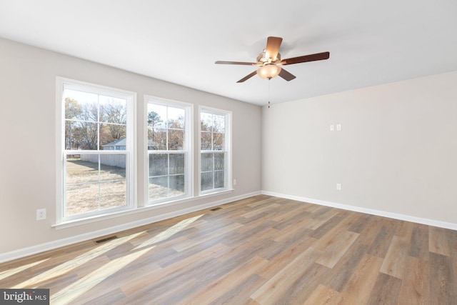 LOT4 Lakeview Dr, Colonial Beach, VA 22443 - empty room featuring a wealth of natural light, visible vents, and wood finished floors