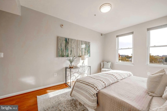 bedroom with hardwood / wood-style floors