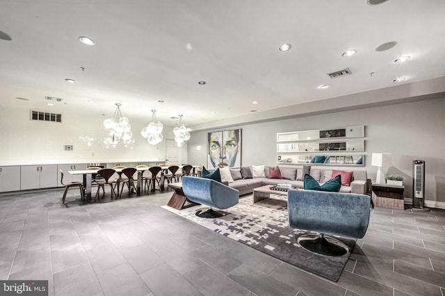 living room with a notable chandelier