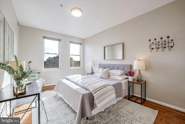 bedroom with hardwood / wood-style flooring