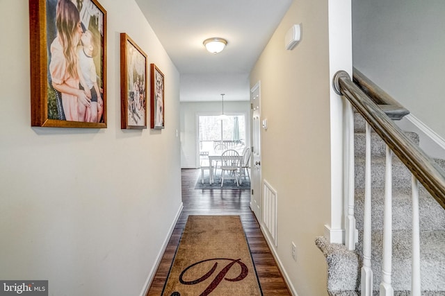 hall with dark hardwood / wood-style floors