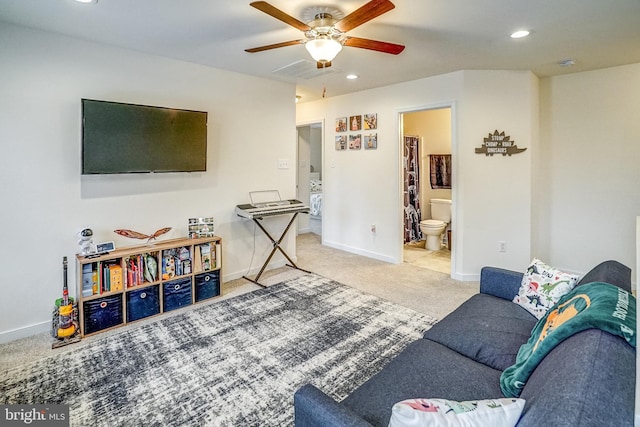 living room featuring ceiling fan and light carpet