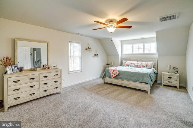 carpeted bedroom with ceiling fan and lofted ceiling