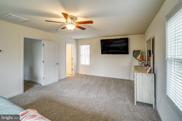 bedroom featuring light carpet and ceiling fan