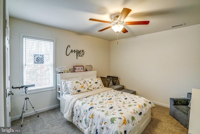 bedroom with light carpet and ceiling fan