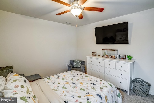 bedroom featuring ceiling fan and light carpet