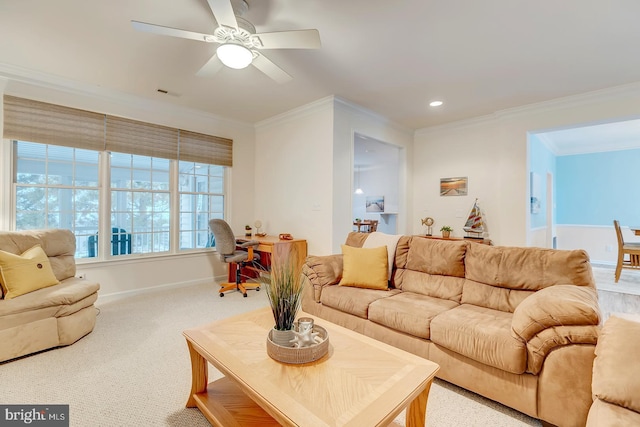 living room with carpet, ceiling fan, and ornamental molding