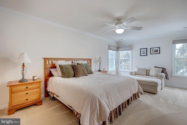 bedroom with ceiling fan, light carpet, and ornamental molding