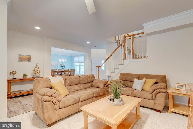 living room with crown molding and a notable chandelier