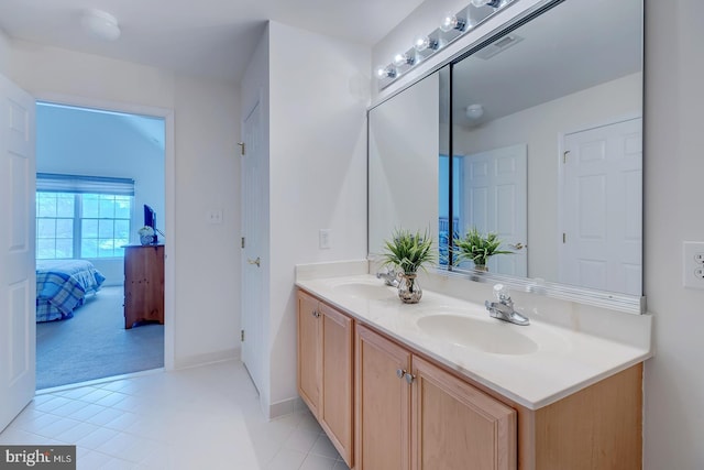 bathroom with tile patterned flooring and vanity