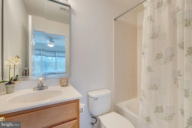 full bathroom with toilet, vanity, and shower / bath combo