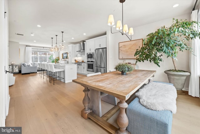 dining space featuring light hardwood / wood-style flooring