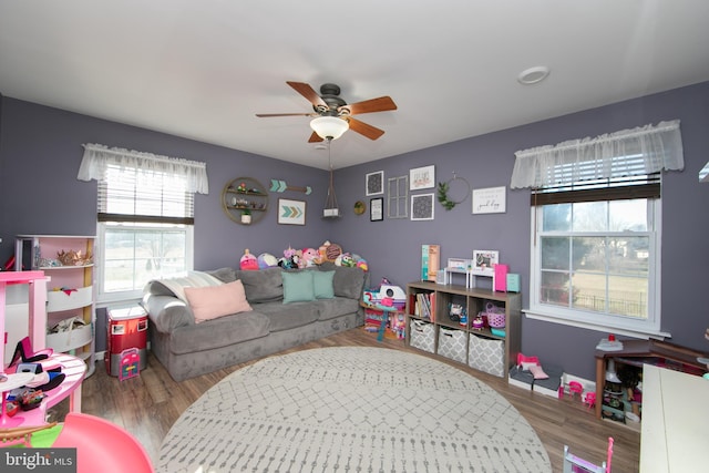 rec room with ceiling fan and hardwood / wood-style flooring