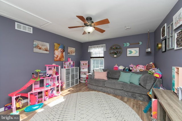 rec room featuring wood-type flooring and ceiling fan