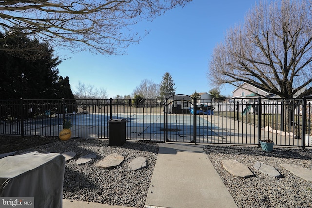 view of pool featuring a playground