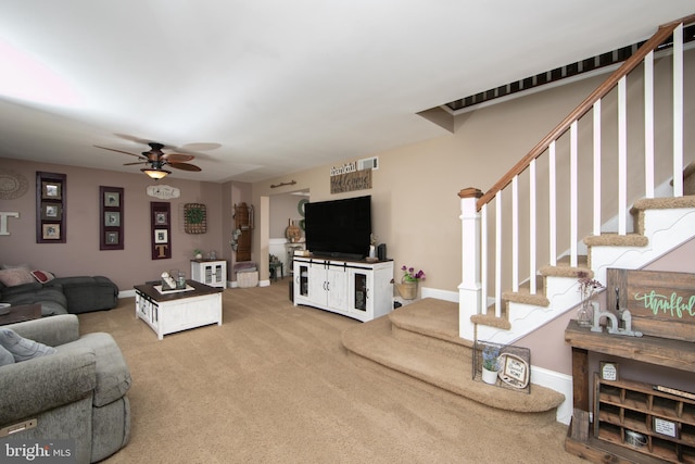 carpeted living room with ceiling fan