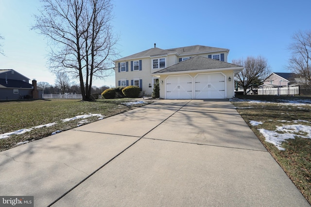 view of front facade featuring a front lawn and a garage