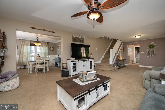 carpeted living room with ceiling fan