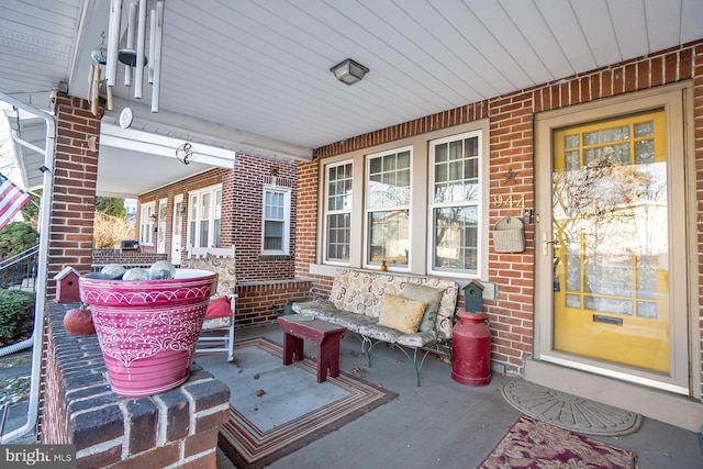 view of patio featuring a porch