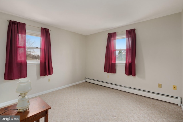 unfurnished room featuring baseboard heating and carpet floors