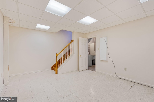 basement featuring a drop ceiling