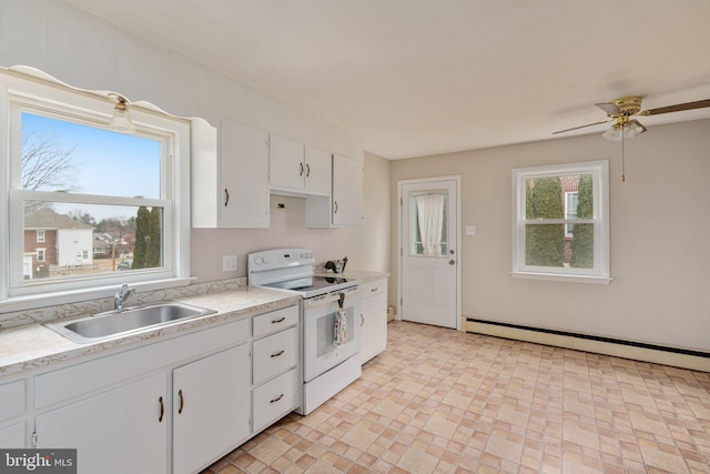 kitchen featuring a baseboard radiator, white electric range, white cabinetry, sink, and ceiling fan