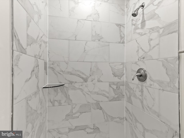 details with a tile shower