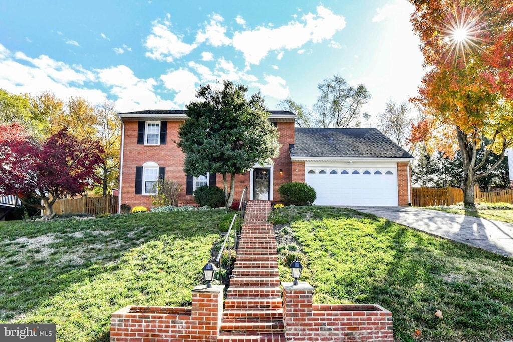 view of front of property featuring a garage and a front yard