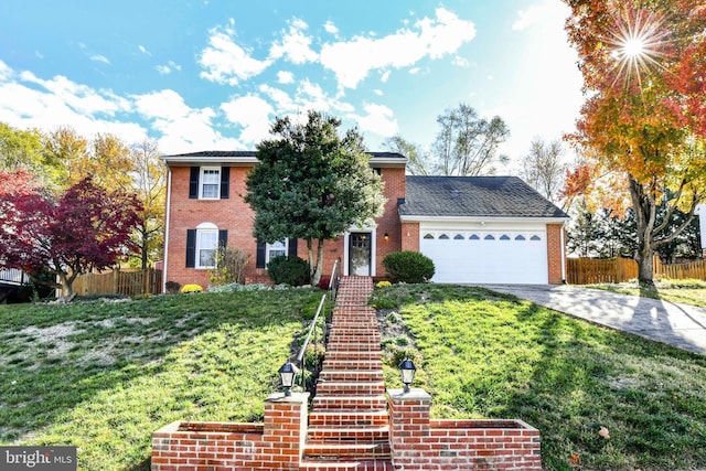 view of front of property featuring a garage and a front yard