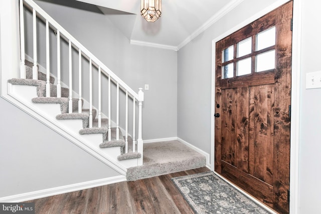 entrance foyer featuring wood-type flooring and ornamental molding