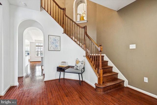 stairs featuring hardwood / wood-style flooring