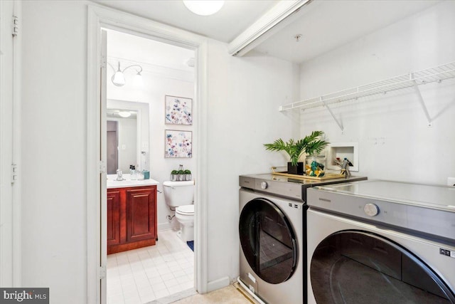 laundry room featuring washing machine and clothes dryer