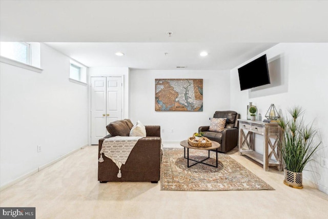 living area featuring light colored carpet