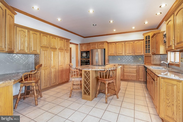 kitchen featuring light tile patterned floors, a breakfast bar area, a sink, built in study area, and black appliances