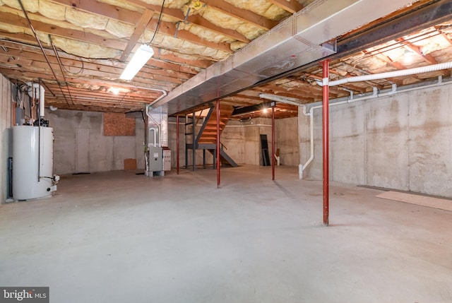 unfinished basement featuring heating unit, stairs, and water heater