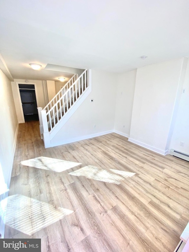 spare room featuring light hardwood / wood-style floors