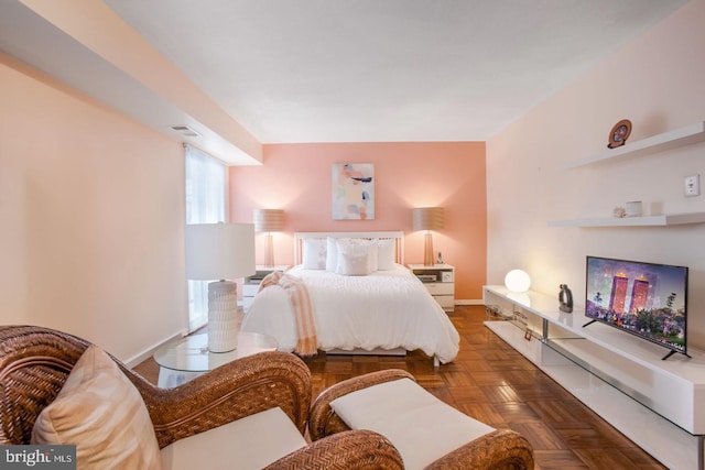 bedroom featuring dark parquet floors