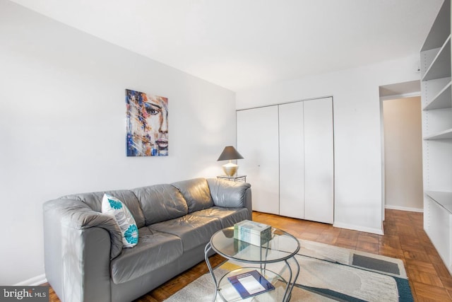 living room featuring parquet flooring