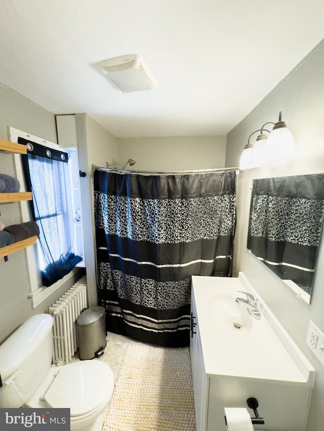 bathroom featuring toilet, vanity, tile patterned floors, a shower with curtain, and radiator heating unit